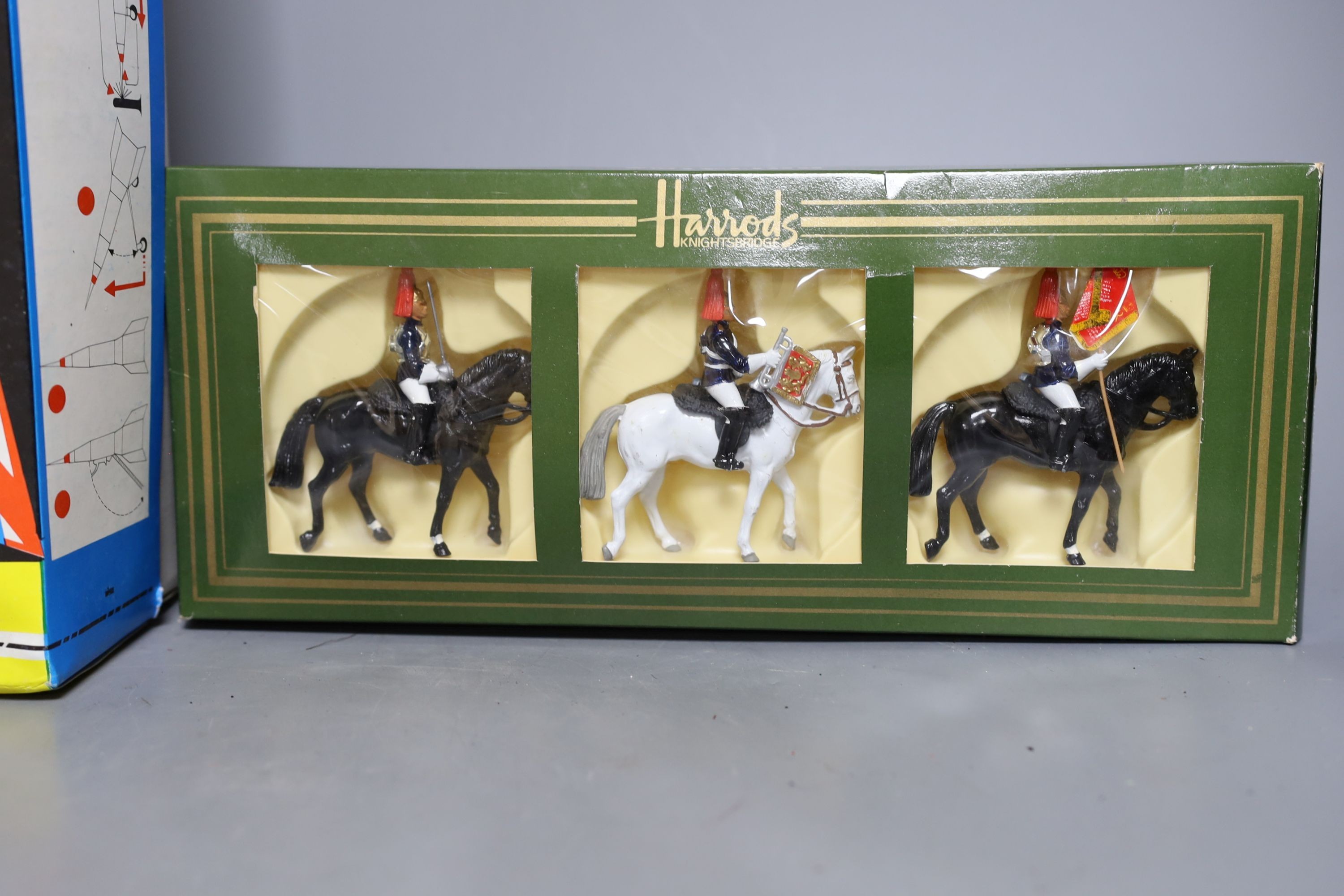 Boxed lithographed tinplate and clockwork toy rocket and various hollowcast lead toys and Bakelite coupe and clockwork monkey, monkey 24cms high.